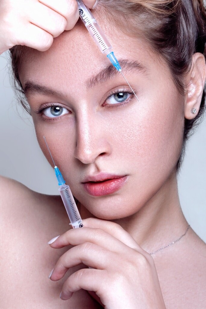 a woman with a needle in her hair